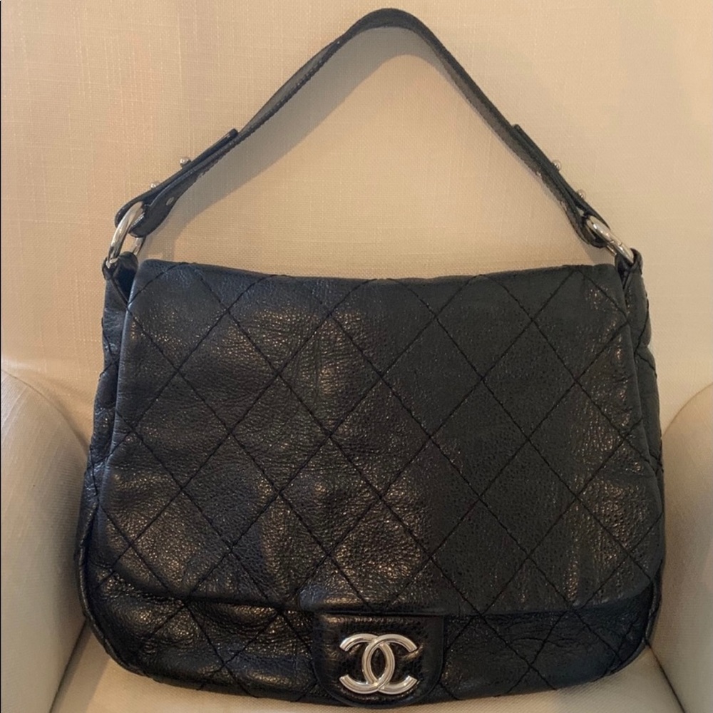 Authentic Chanel Black Leather XL. On the Road bag